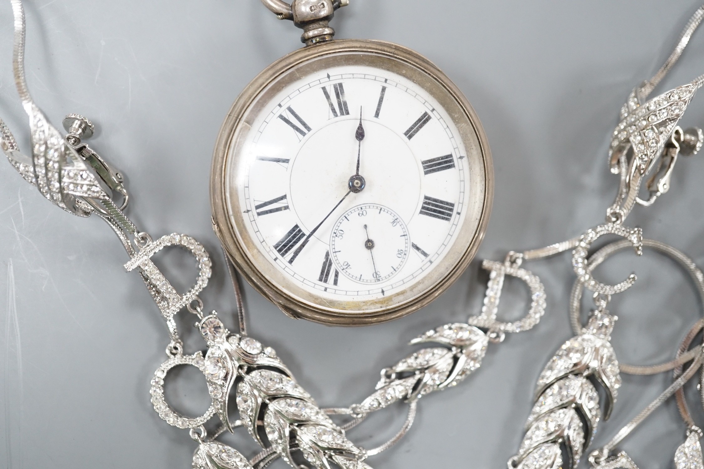 A Victorian silver open faced keywind pocket watch and a paste set suite of jewellery.